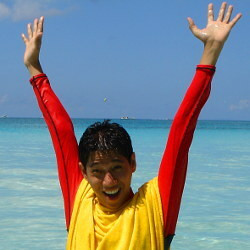 Lifeguard signals both hands up danger